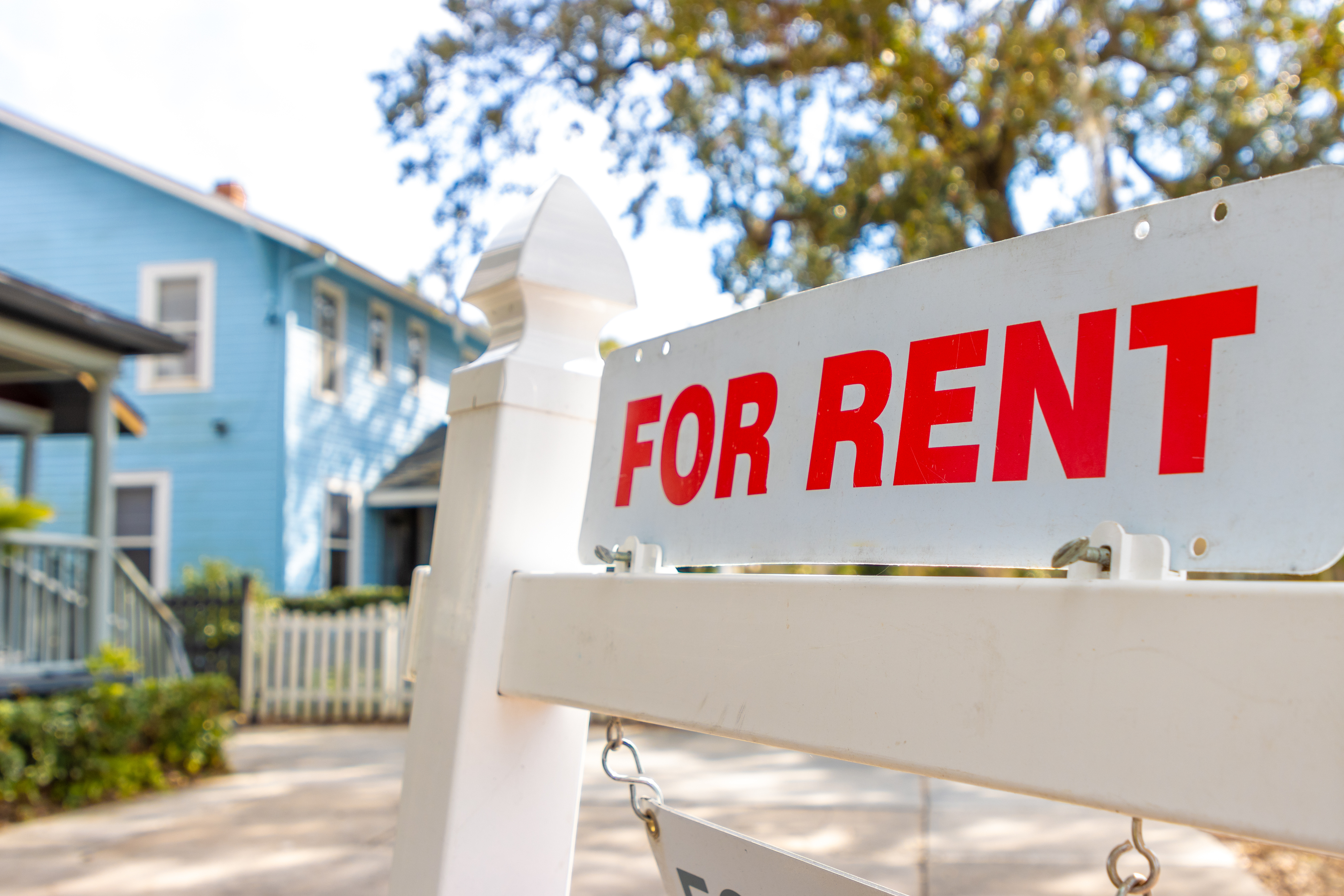 A close up shot of a for rent sign